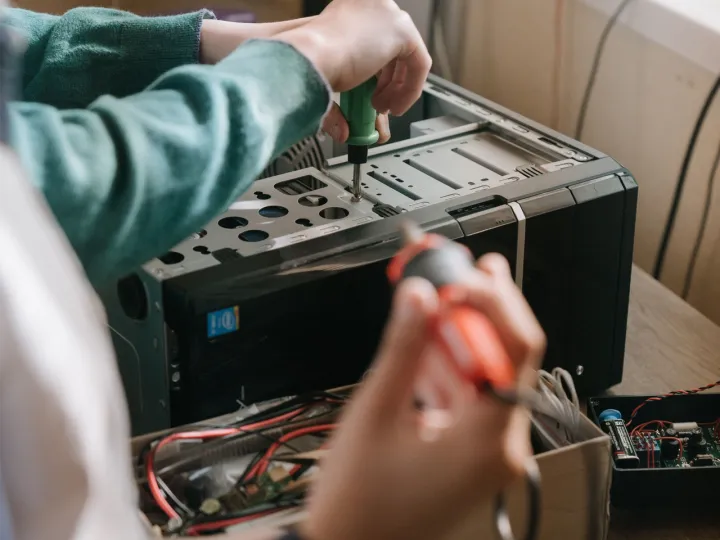 A technician repairing a desktop computer